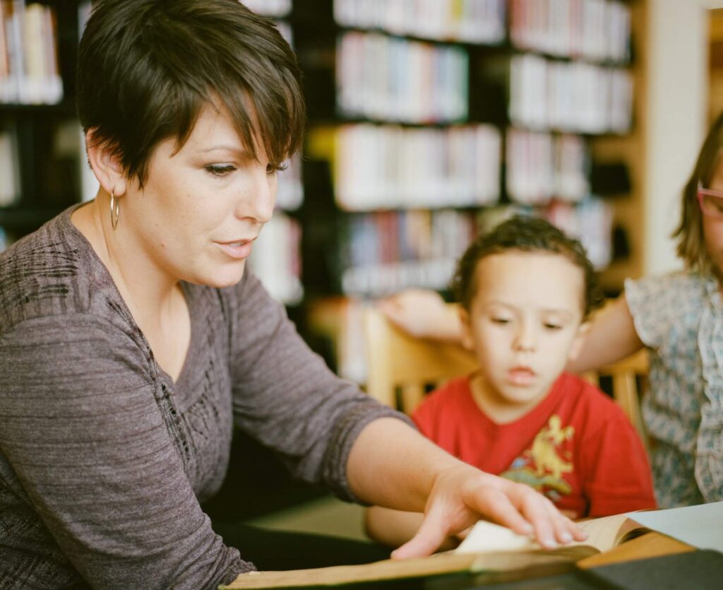 a teacher reading to a student